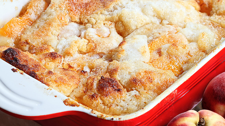 Close-up of Texas-style peach cobbler in ceramic dish