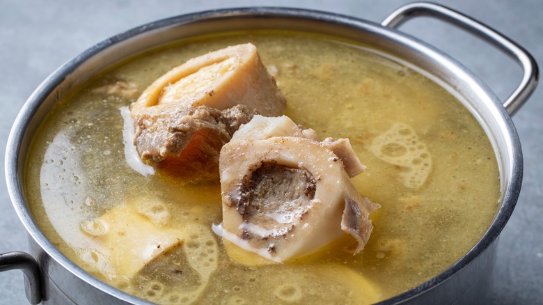 Boiling beef bones in pot