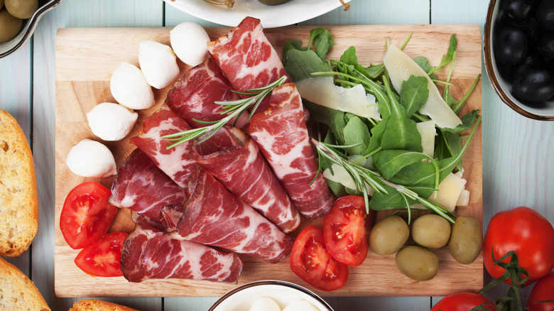 capicola with mozzarella, olives, tomatoes, and arugula 