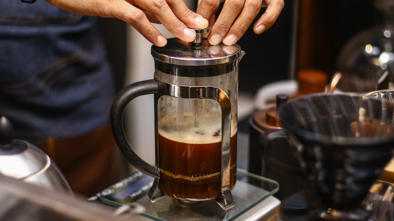 Person using a French press