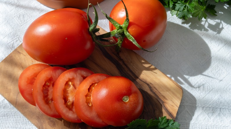 whole and sliced Roma tomatoes