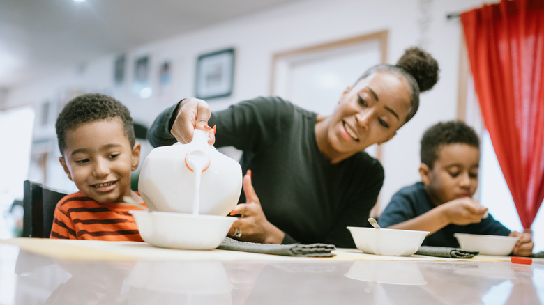 mother pouring milk