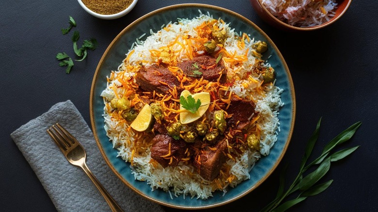 Biryani with lemon wedges