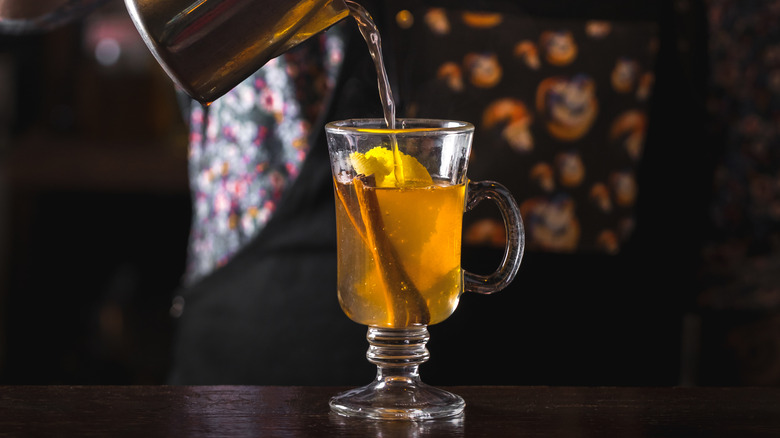 Bartender creating a hot toddy