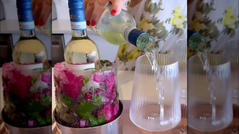 A floral ice wine chiller next to pouring wine