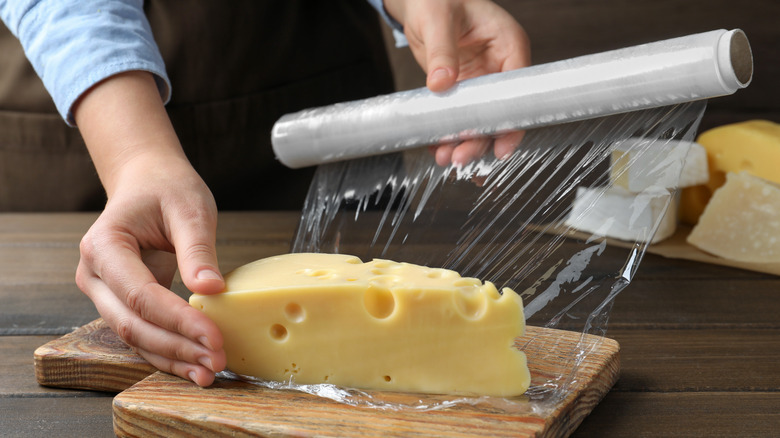 cheese wedge wrapped in plastic