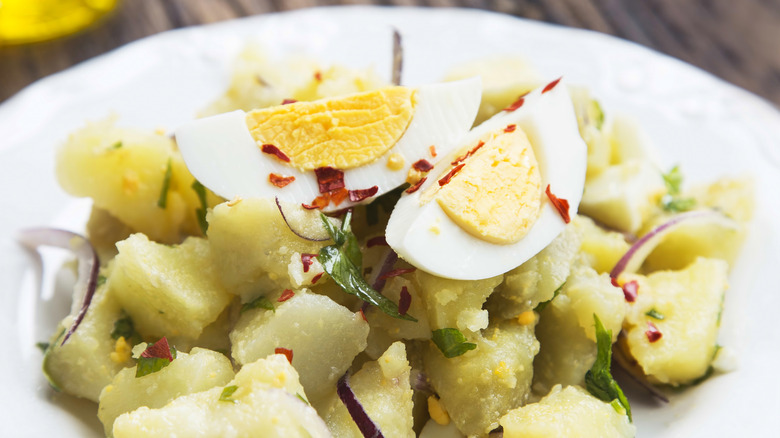 Potato salad with egg and red onion