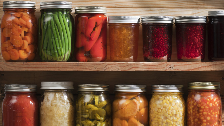 Various canned foods in jars on shelf