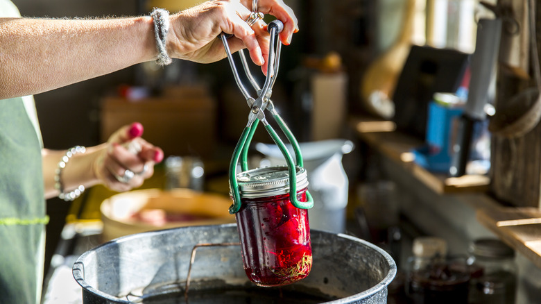 A person water bath canning