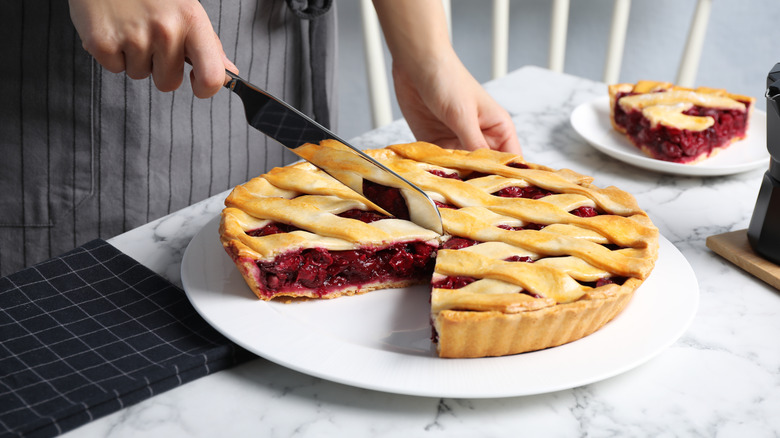 cutting a fruit pie