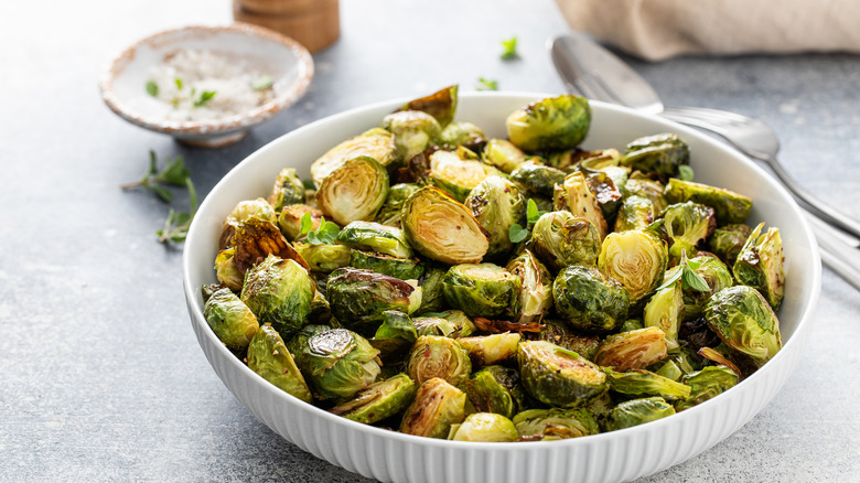 Crispy Brussels sprouts in white bowl