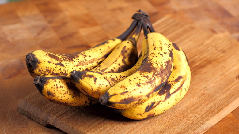 Ripe bananas on wood 