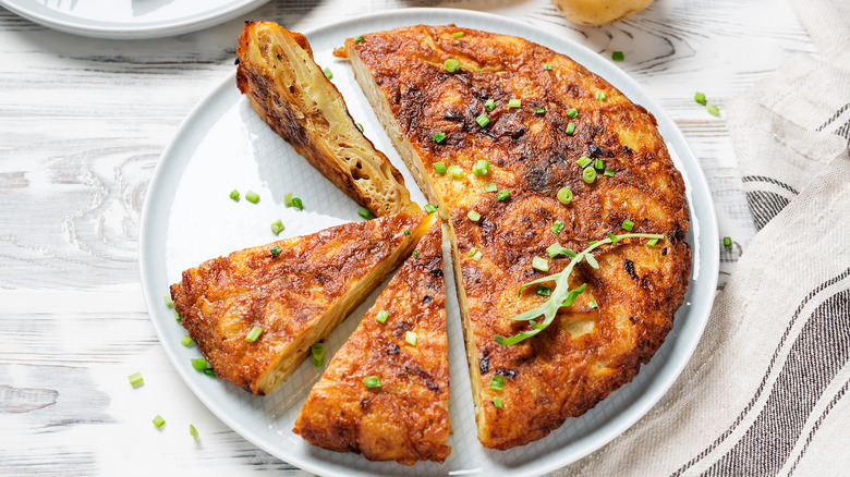 plated omelet garnished with chives