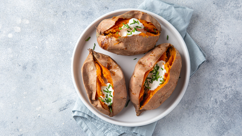 Three baked sweet potatoes.