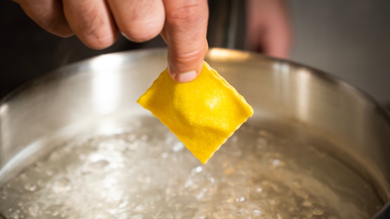 Removing ravioli from pot