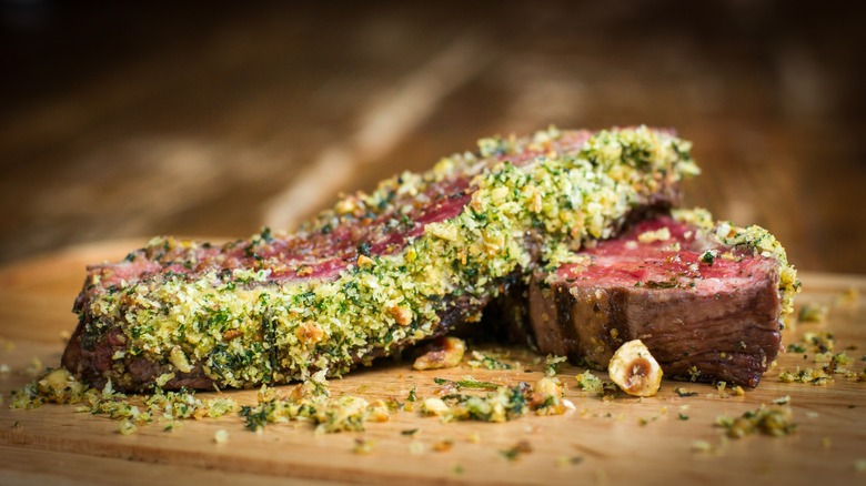 slices of herb crusted flank steak