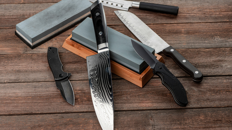 Knives and whetstones on wood