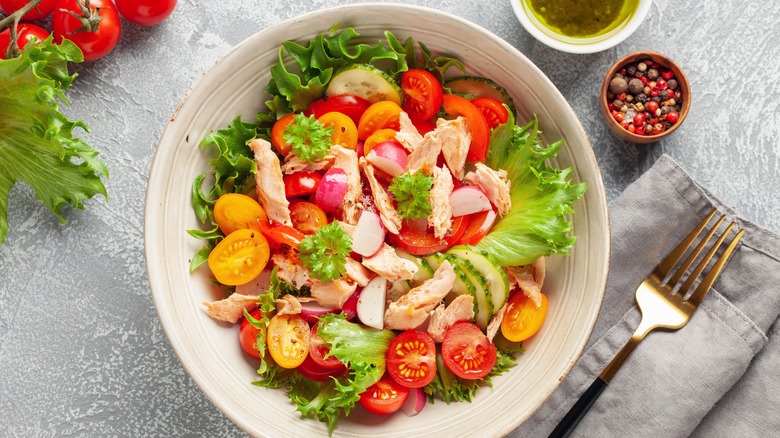 Salad with tuna, tomatoes, lettuce, in bowl