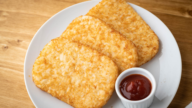 Hash brown patties with ketchup