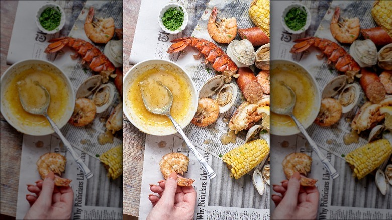 seafood boil over a newspaper-lined table