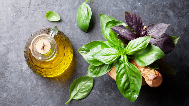 olive oil and basil leaves