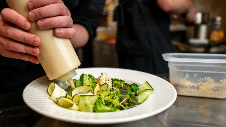 Squeeze bottle over greens