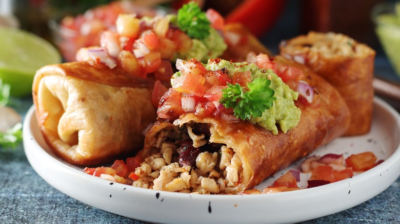 Chimichangas on white plate