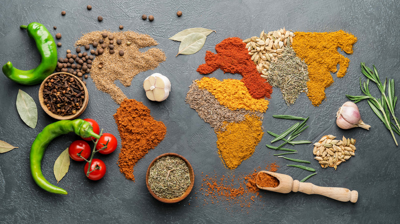 Variety of ground spices on a gray background