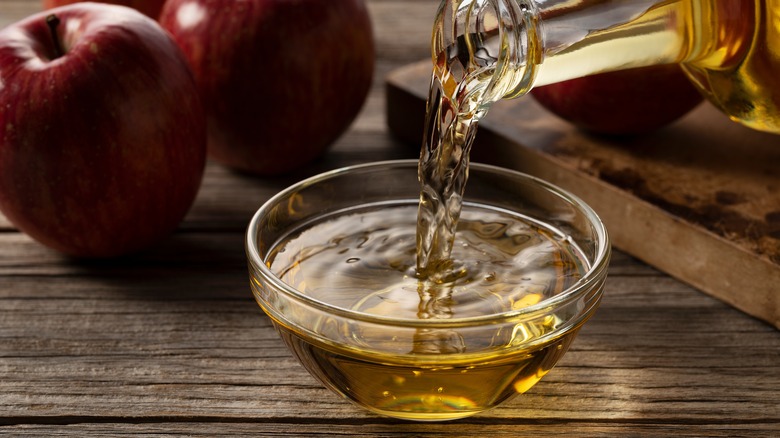 Apple cider vinegar being poured