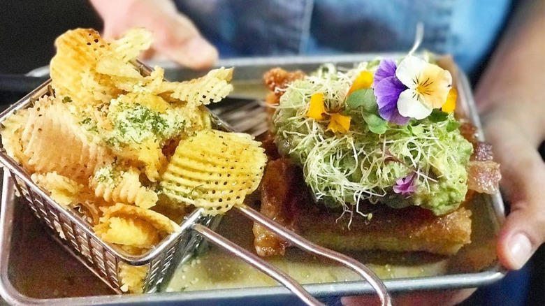 Avocado sprout BLT with edible flowers and chips from EAT KBC