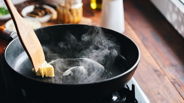 melting fat in a hot skillet