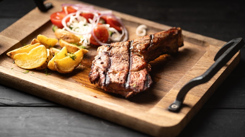 Grilled lamb ribs on a cutting board