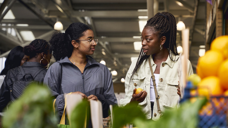 Two women talking in the grocery store