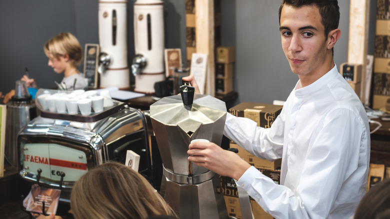 Italian barista pouring espresso