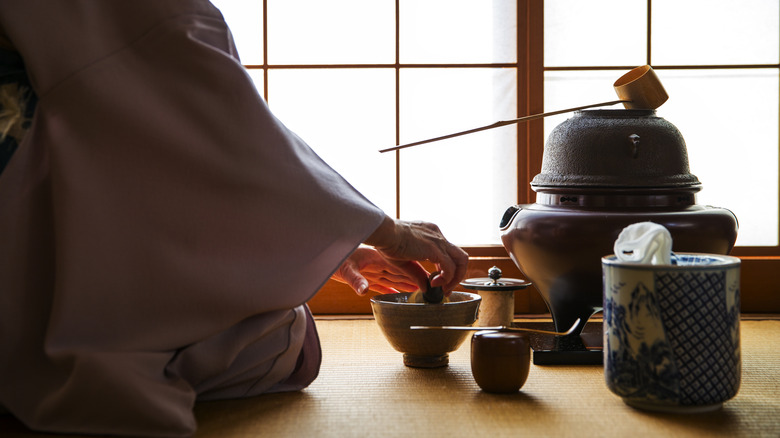 woman preparing tea for Japanese ceremony