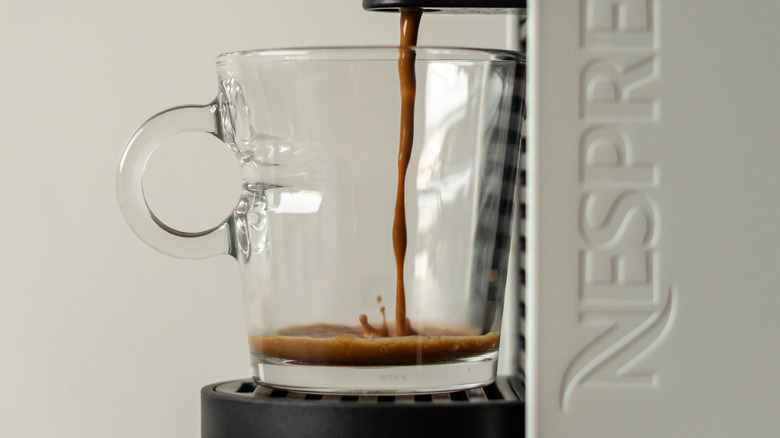 A brewing Nespresso machine.