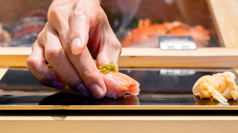 sushi chef plating omakase