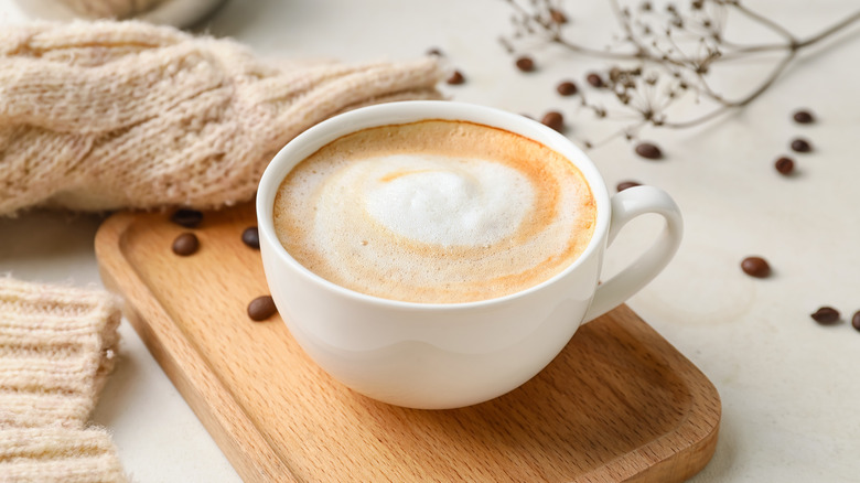 frothy cappuccino on wood