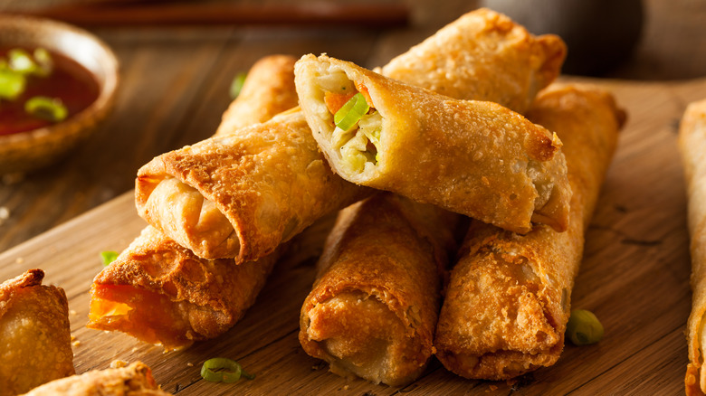 Egg rolls on cutting board 