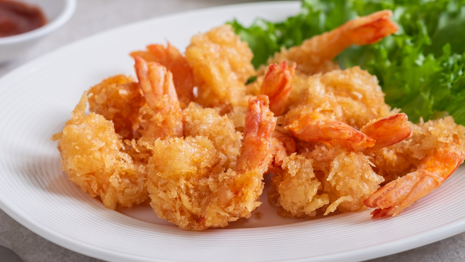 The Extra Step That's Worth It To Ensure Batter Sticks To Fried Shrimp