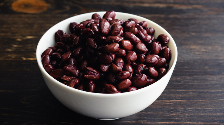 cooked black beans in a white bowl