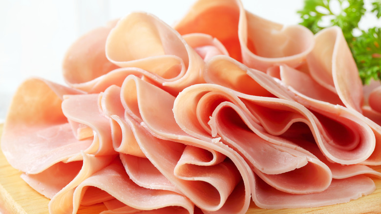 sliced ham on cutting board