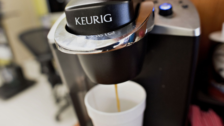 keurig machine brewing coffee