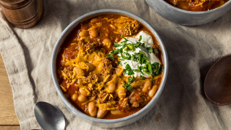 A bowl of homemade turkey chili on cloth