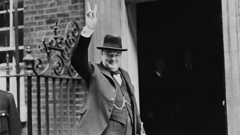 Winston Churchill making Victory sign, black and white