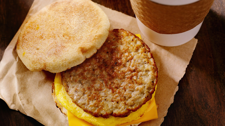 fast food breakfast sandwich and coffee to go