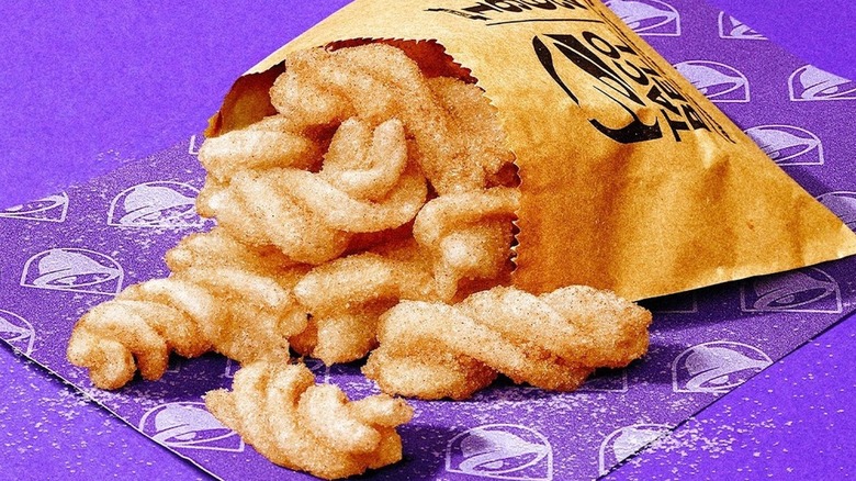 close up of Taco Bell cinnamon twists on purple background