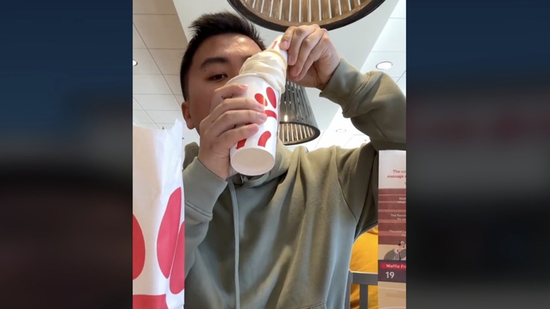 TikTok creator drinking a ice cream float from Chick-fil-A