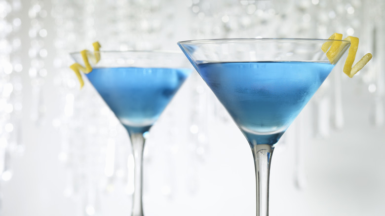 Blue martini cocktails with a lemon twist