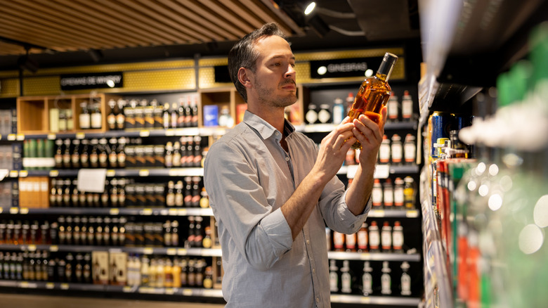 man shopping for whisky